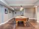Finished basement with a pool table, recessed lighting, and hardwood floors, perfect for entertaining at 2301 Keara Way, Charlotte, NC 28270