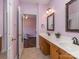 Inviting bathroom with double sinks, decorative mirrors, and a neutral color scheme that creates a relaxing atmosphere at 2301 Keara Way, Charlotte, NC 28270