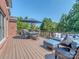 Spacious deck with outdoor seating and a dining area, offering stunning views of the surrounding greenery at 2301 Keara Way, Charlotte, NC 28270