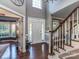 Grand foyer with hardwood floors, a staircase, and a view into other living spaces at 2301 Keara Way, Charlotte, NC 28270