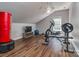 Well-equipped home gym with exercise equipment, natural light and hardwood floors at 2301 Keara Way, Charlotte, NC 28270