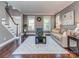 Cozy living room with hardwood floors, neutral paint, and plenty of natural light at 2301 Keara Way, Charlotte, NC 28270