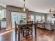 Open concept dining room/living room with hardwood floors and tons of natural light at 2301 Keara Way, Charlotte, NC 28270