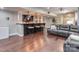 Cozy living room with a wet bar, dark wood floors, and comfortable seating, perfect for entertaining at 2301 Keara Way, Charlotte, NC 28270