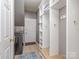 Organized mudroom with built-in shelving, hooks, and a bench for efficient storage and functionality at 2301 Keara Way, Charlotte, NC 28270