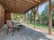 Covered patio with seating area and backyard access, ideal for outdoor relaxation and entertaining at 2301 Keara Way, Charlotte, NC 28270