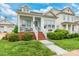 Inviting two-story home with a porch, brick steps and an easy to maintain landscaped yard at 23128 Goose Down Ln, Lancaster, SC 29720
