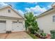 Detached garage with driveway and lovely landscaping provides ample parking and curb appeal at 23128 Goose Down Ln, Lancaster, SC 29720