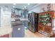 Stylish kitchen with stainless steel appliances, dark countertops, grey cabinets and a kitchen island at 23128 Goose Down Ln, Lancaster, SC 29720