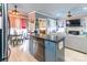Open kitchen flowing to the living room featuring an island with granite countertop and stainless-steel dishwasher at 23128 Goose Down Ln, Lancaster, SC 29720