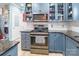 Well-equipped kitchen featuring stainless steel oven, microwave, and plenty of cabinet space for ample storage at 23128 Goose Down Ln, Lancaster, SC 29720