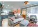 Comfortable open living room with hardwood floors, lots of natural light, and an adjacent kitchen at 23128 Goose Down Ln, Lancaster, SC 29720