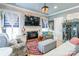 Comfortable living room with a brick fireplace, stylish decor, hard wood floors and lots of natural light at 23128 Goose Down Ln, Lancaster, SC 29720