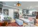 Open-concept living room, with an adjoining kitchen, hardwood floors, stylish decor and lots of natural light at 23128 Goose Down Ln, Lancaster, SC 29720
