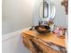 Chic powder room featuring a live edge wood countertop and vessel sink at 23128 Goose Down Ln, Lancaster, SC 29720
