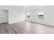 Bright, vacant bedroom with two windows and wood-look floors at 2322 Joes Lake Rd, Shelby, NC 28152