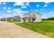 Charming two-story home featuring a well-manicured lawn with lush, green grass, plus plentiful parking spaces at 2322 Joes Lake Rd, Shelby, NC 28152