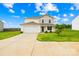 Attractive two-story home with an attached garage, a well-kept lawn, and a freshly sealed driveway at 2322 Joes Lake Rd, Shelby, NC 28152