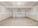 Unfinished garage space with overhead lighting, ready for customization at 2322 Joes Lake Rd, Shelby, NC 28152