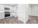 A well-lit kitchen featuring stainless steel appliances and pristine white cabinetry at 2322 Joes Lake Rd, Shelby, NC 28152