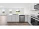 Modern kitchen with stainless steel appliances, granite countertops, and wood flooring at 2322 Joes Lake Rd, Shelby, NC 28152
