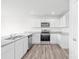 Bright kitchen with white cabinets, stainless steel appliances, and granite countertops at 2322 Joes Lake Rd, Shelby, NC 28152