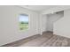 Inviting living room features a bright window, new floors, and access to the staircase at 2322 Joes Lake Rd, Shelby, NC 28152