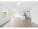 Spacious open-concept living room with wood floors, plenty of natural light, and kitchen view at 2322 Joes Lake Rd, Shelby, NC 28152
