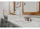 Elegant bathroom with double vanity, gray cabinets, and modern faucet at 2329 Club Rd, Charlotte, NC 28205