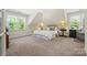 Sunlit bedroom with a cozy atmosphere, featuring plush carpeting and a pair of windows at 2329 Club Rd, Charlotte, NC 28205