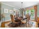 Dining room featuring stylish table, seating, and views to other rooms at 2329 Club Rd, Charlotte, NC 28205