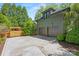 Detached two-car garage with a spacious driveway and a wooden privacy fence at 2329 Club Rd, Charlotte, NC 28205