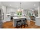 Stylish kitchen featuring a central island, modern appliances, and hardwood floors at 2329 Club Rd, Charlotte, NC 28205