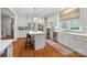 Bright kitchen with white cabinetry, stainless steel appliances, and a center island at 2329 Club Rd, Charlotte, NC 28205