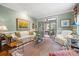 Bright living room showcasing a stylish interior, ample seating, and view to the dining room at 2329 Club Rd, Charlotte, NC 28205