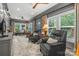 A relaxing sitting room with comfortable recliners and light streaming in from many windows at 2329 Club Rd, Charlotte, NC 28205