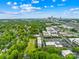Charlotte NC condo view with skyline background and green canopy at 2338 Yadkin Ave # D302, Charlotte, NC 28205