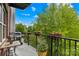 A cozy balcony is equipped with a grill, a table, and potted plants for a relaxing outdoor space at 2338 Yadkin Ave # D302, Charlotte, NC 28205