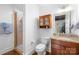 Bathroom features a glass-enclosed shower, granite countertop, and ample vanity storage at 2338 Yadkin Ave # D302, Charlotte, NC 28205