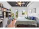 Comfortable bedroom with desk, shelves, and balcony access offering great natural light at 2338 Yadkin Ave # D302, Charlotte, NC 28205