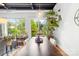 Bright dining area with natural light, exposed ceiling, and decorative houseplants at 2338 Yadkin Ave # D302, Charlotte, NC 28205