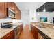 Open kitchen layout with granite countertops, stainless appliances, and pendant lighting at 2338 Yadkin Ave # D302, Charlotte, NC 28205