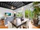 Bright living space features a modern ceiling, a ceiling fan, and natural light streaming from the glass doors to the balcony at 2338 Yadkin Ave # D302, Charlotte, NC 28205