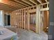 An unfinished basement with exposed wooden framing, offering potential for customization and additional living space at 2442 Falcon Ln, Statesville, NC 28625