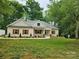 Charming brick home with well-manicured lawn and lush landscaping at 2442 Falcon Ln, Statesville, NC 28625