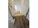 Interior view of a staircase with hardwood floors and white accents at 2442 Falcon Ln, Statesville, NC 28625
