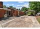 Expansive backyard featuring a brick home, a detached carport and a paved driveway at 24501 Canton Rd, Albemarle, NC 28001