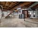 Unfinished basement with concrete floor and staircase at 24501 Canton Rd, Albemarle, NC 28001