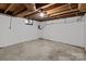 Unfinished basement with exposed ceiling and concrete floor at 24501 Canton Rd, Albemarle, NC 28001