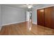 Comfortable bedroom with hardwood floors, closet space, and access to an adjoining room at 24501 Canton Rd, Albemarle, NC 28001